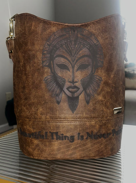 “A Beautiful Thing is Never Perfect” Bucket Bag